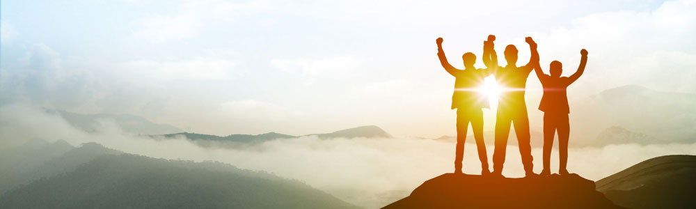 People celebrating on a mountain top