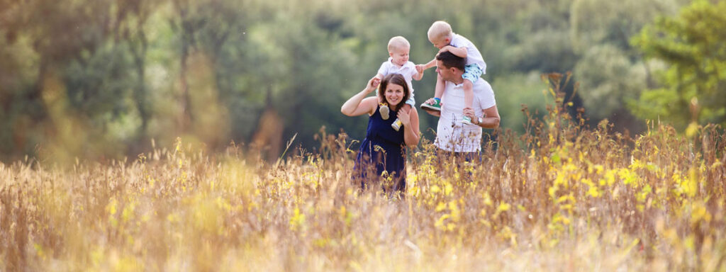 Family walking through a field