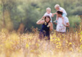 Family walking through a field