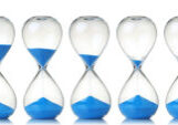 Hourglass with blue sand